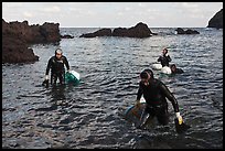 Women divers emerging from water. Jeju Island, South Korea (color)