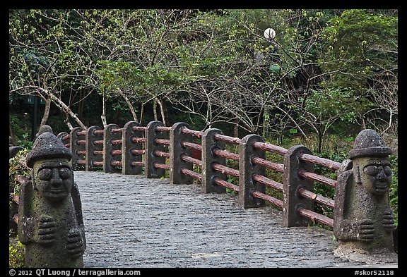 Footbridge and Dolharubang statues, Seogwipo. Jeju Island, South Korea