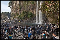 Tourists at the base of Jeongbang Pokpo falls, Seogwipo. Jeju Island, South Korea (color)
