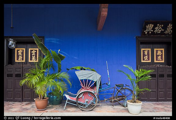 Trishaw and doors, Cheong Fatt Tze Mansion. George Town, Penang, Malaysia