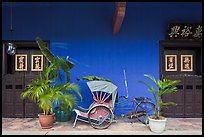 Trishaw and doors, Cheong Fatt Tze Mansion. George Town, Penang, Malaysia (color)