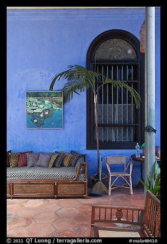 Chairs and blue wall, Cheong Fatt Tze Mansion. George Town, Penang, Malaysia
