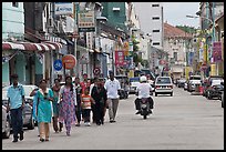 Malay people walking on street. George Town, Penang, Malaysia ( color)