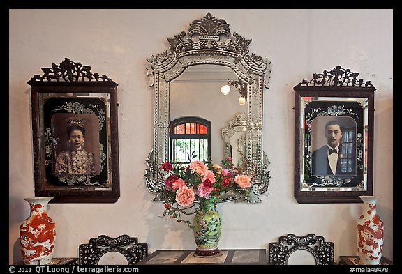 Portraits and mirors, Pinang Peranakan Mansion. George Town, Penang, Malaysia