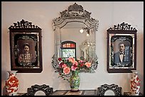 Portraits and mirors, Pinang Peranakan Mansion. George Town, Penang, Malaysia