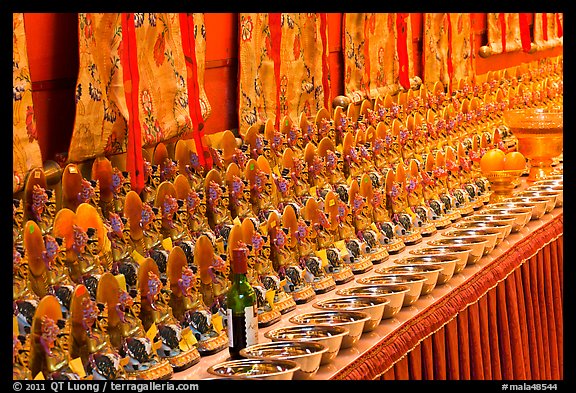Rows of Jambhala figures, Gelugpa Buddhist Association temple. George Town, Penang, Malaysia