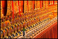 Rows of Jambhala figures, Gelugpa Buddhist Association temple. George Town, Penang, Malaysia (color)