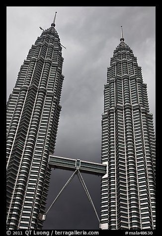 Petronas Towers (tallest twin towers in the world) and stormy sky. Kuala Lumpur, Malaysia