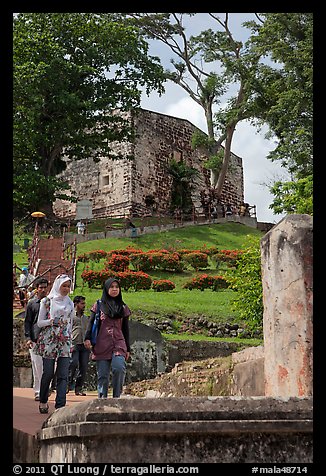 Malay tourists descend stairs from St Paul Hill. Malacca City, Malaysia