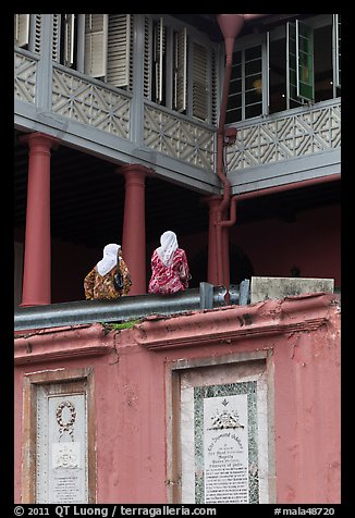 Women sitting, Stadthuys. Malacca City, Malaysia