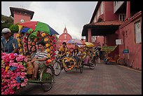 Trishaws leaving Town Square and Stadthuys. Malacca City, Malaysia (color)