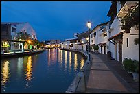 Houses and walkway at dusk, Melaka River. Malacca City, Malaysia (color)