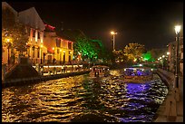Tour boats on Melaka River at night. Malacca City, Malaysia