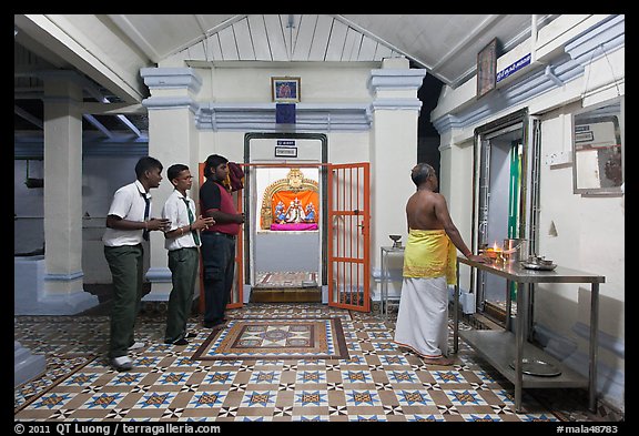 Worhipers and holy man, Sri Poyyatha Vinayagar Moorthi Temple. Malacca City, Malaysia (color)