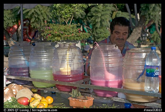 Multicolored drinks offered on a street stand. Guadalajara, Jalisco, Mexico (color)