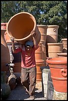 Man carrying a heavy pot, Tonala. Jalisco, Mexico ( color)