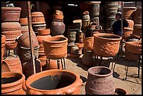 Boy standing next to clay pots, Tonala. Jalisco, Mexico (color)