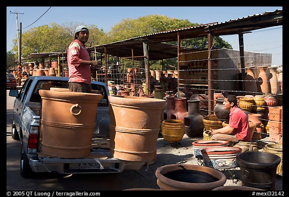 Pots being loaded on the back of a pick-up truck, Tonala. Jalisco, Mexico