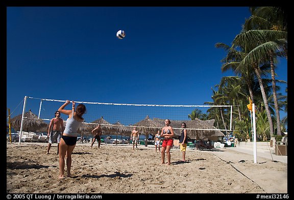 Vacationers playing beach volley-ball, Nuevo Vallarta, Nayarit. Jalisco, Mexico