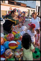 Children, mother, and balloon vendor , Puerto Vallarta, Jalisco. Jalisco, Mexico (color)