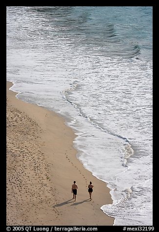 Couple walking on the beach seen from above, Puerto Vallarta, Jalisco. Jalisco, Mexico (color)