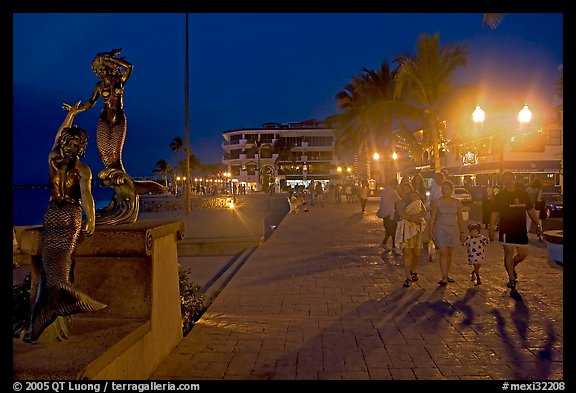 People strolling on the Malecon at night, Puerto Vallarta, Jalisco. Jalisco, Mexico (color)