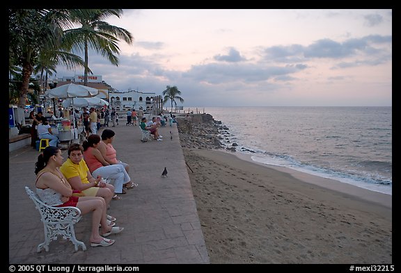 Women sitting on a bench looking at the ocean, Puerto Vallarta, Jalisco. Jalisco, Mexico