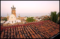 Tiled rooftop and Cathedral, and ocean at dawn, Puerto Vallarta, Jalisco. Jalisco, Mexico (color)