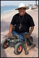 Man without legs  smiling on the Malecon, Puerto Vallarta, Jalisco. Jalisco, Mexico ( color)