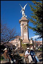 Men wearing cow-boy hats sitting in Garden of Independencia. Zacatecas, Mexico ( color)