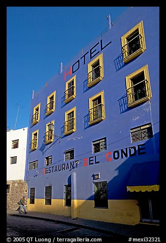 Hotel restaurant building painted bright blue and yellow. Guanajuato, Mexico