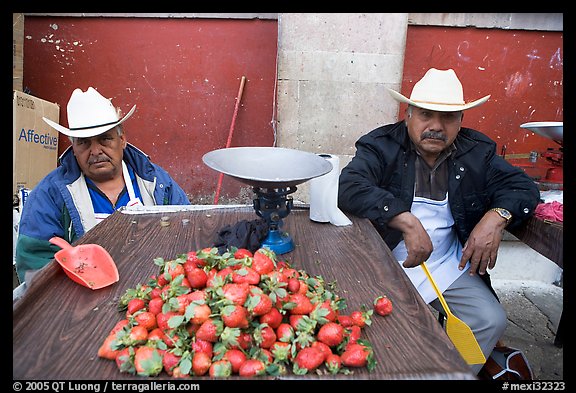 Men with cow-boy hats selling strawberries. Guanajuato, Mexico