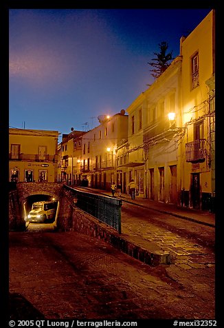 Juarez street and subterranean street with bus at night. Guanajuato, Mexico (color)