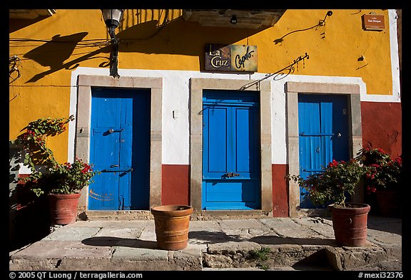 Blue doors and yellow wall on Plaza San Roque. Guanajuato, Mexico