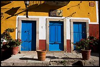 Blue doors and yellow wall on Plaza San Roque. Guanajuato, Mexico