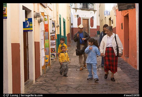 Family walking down an alley. Guanajuato, Mexico