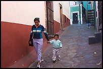 Woman and boy walking down an alleyway. Guanajuato, Mexico ( color)