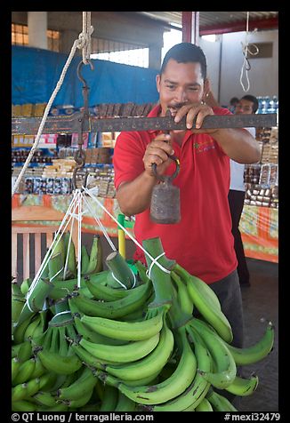 Man weighting bananas. Mexico