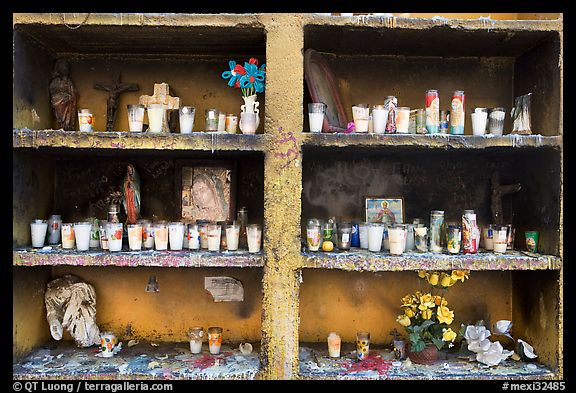 Candles in a roadside chapel. Mexico