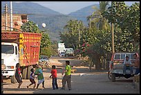 Children playing with a ball in village street. Mexico (color)