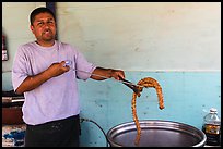 Man making churros. Baja California, Mexico (color)