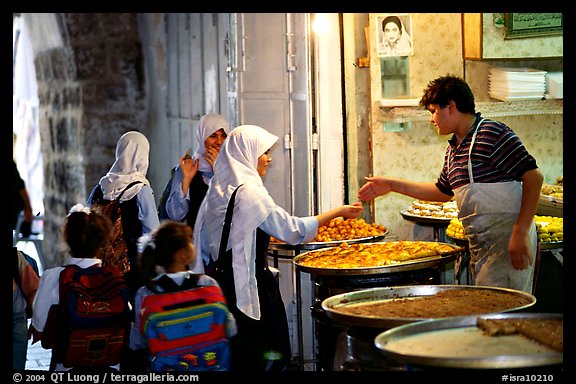 Muslem women purchasing sweets. Jerusalem, Israel