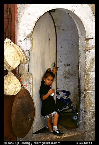 Girl in a doorway. Jerusalem, Israel (color)