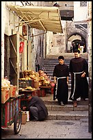 Two christian monks in a narrow alley. Jerusalem, Israel ( color)
