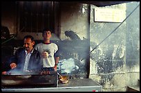 Food vendor broiling meat. Jerusalem, Israel ( color)