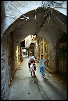 Two children under an archway, Hebron. West Bank, Occupied Territories (Israel) (color)