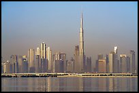Dubai skyline with Burj Khalifa reflected in Dubai Creek. United Arab Emirates ( color)