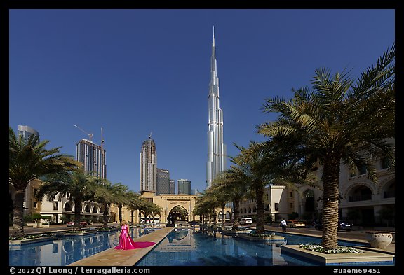 Model and Burj Khalifa from reflecting pool. United Arab Emirates (color)