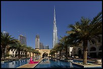 Model and Burj Khalifa from reflecting pool. United Arab Emirates ( color)