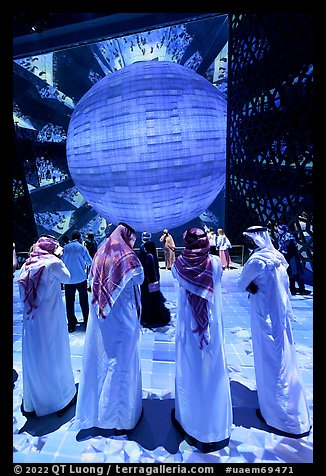 Men in kandura at light show, Saudi Arabia Pavilion. Expo 2020, Dubai, United Arab Emirates (color)